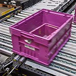 MINI Plant Oxford - The pop up roller system transports unread totes across to the main conveyor line ready for sortation